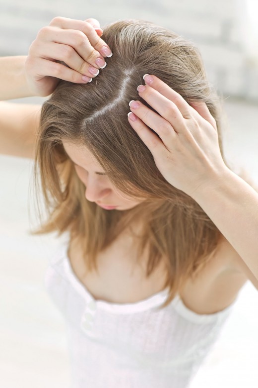 How to pH balance your hair. The right pH level for hair. How the wrong pH could be contributing to dandruff, itchy scalp, and dermatitis. The optimal pH level of your hair, skin, and scalp. How the wrong pH level could be damaging your hair, and how to fix it. Photo © nuzza11 / Adobe Stock
